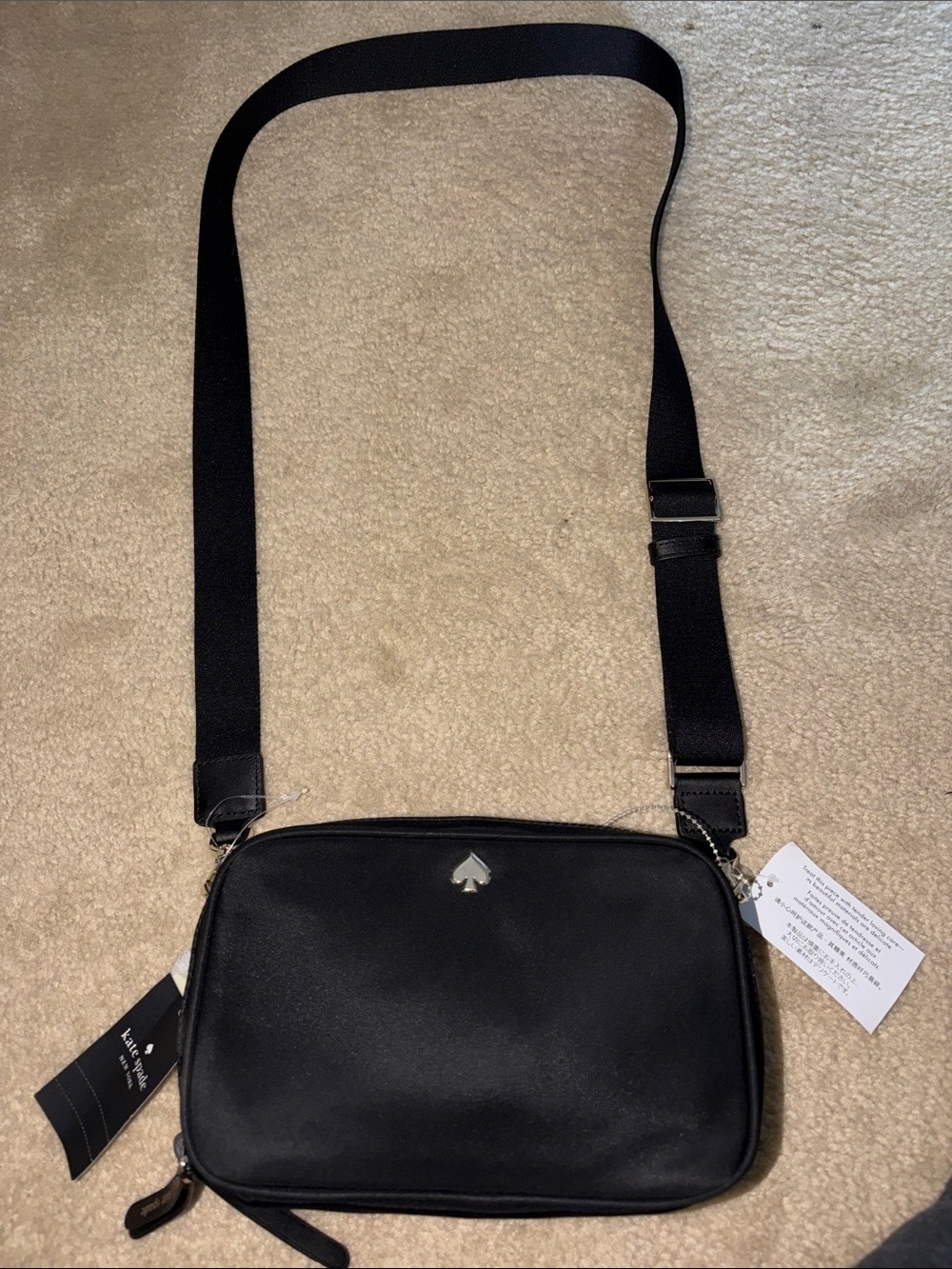 kate spade black leather crossbody camera bag with silver spade logo